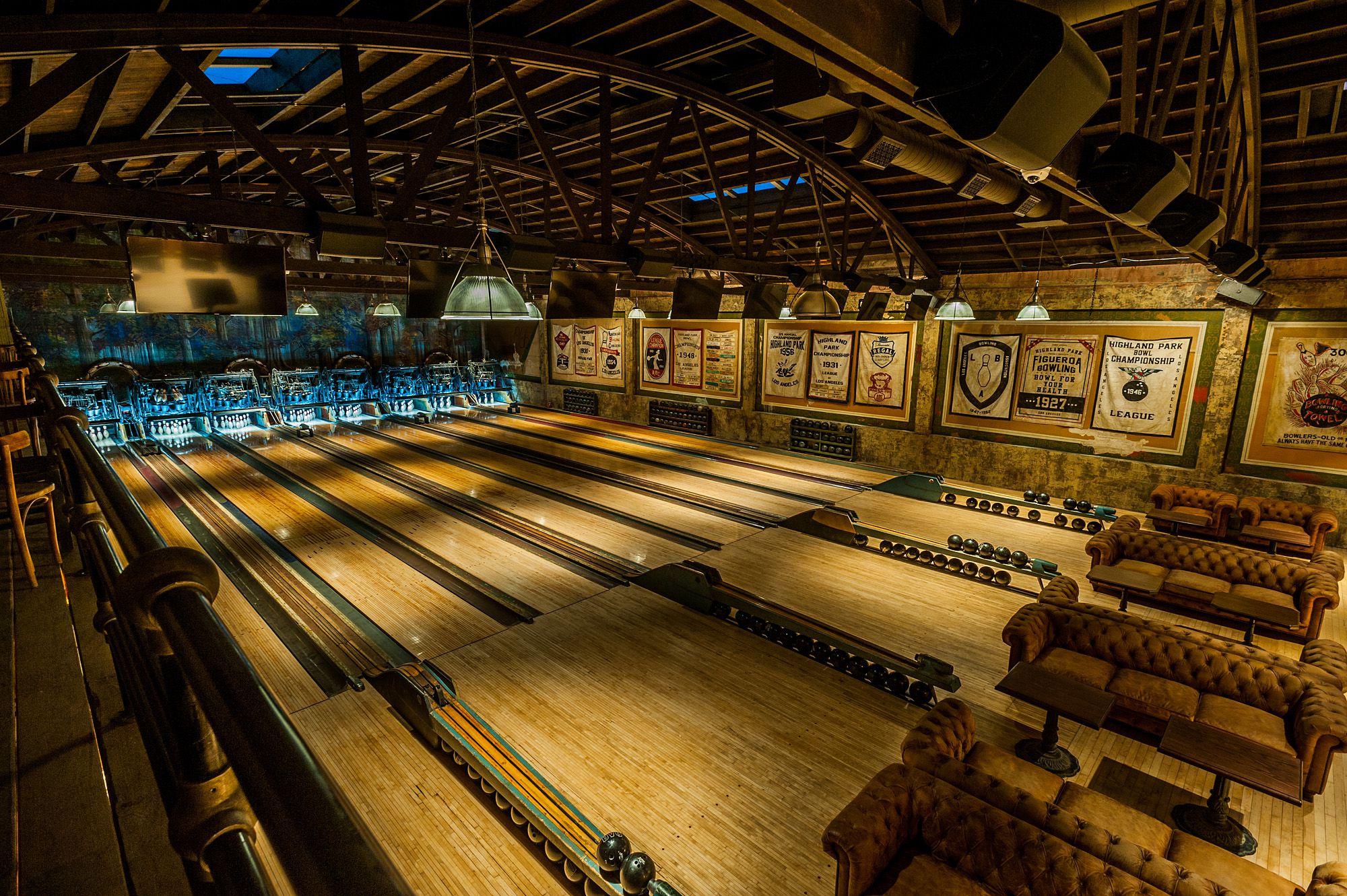 Vintage bowling alley with wooden lanes and classic decor.