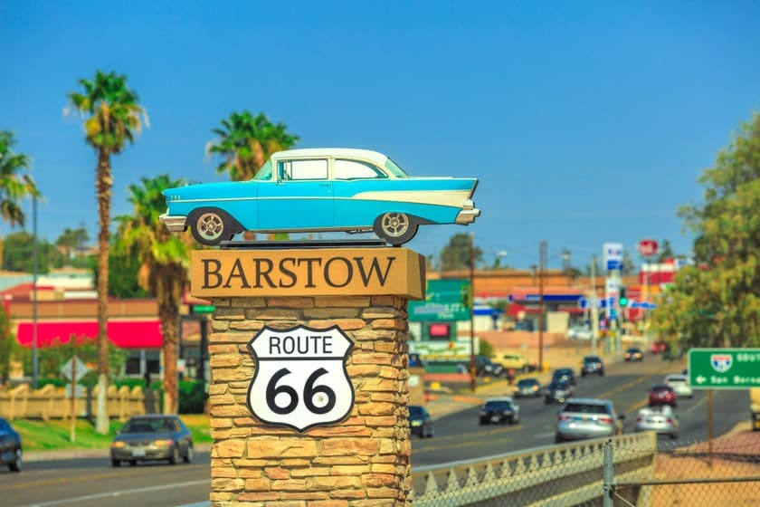 Classic car atop Barstow Route 66 sign