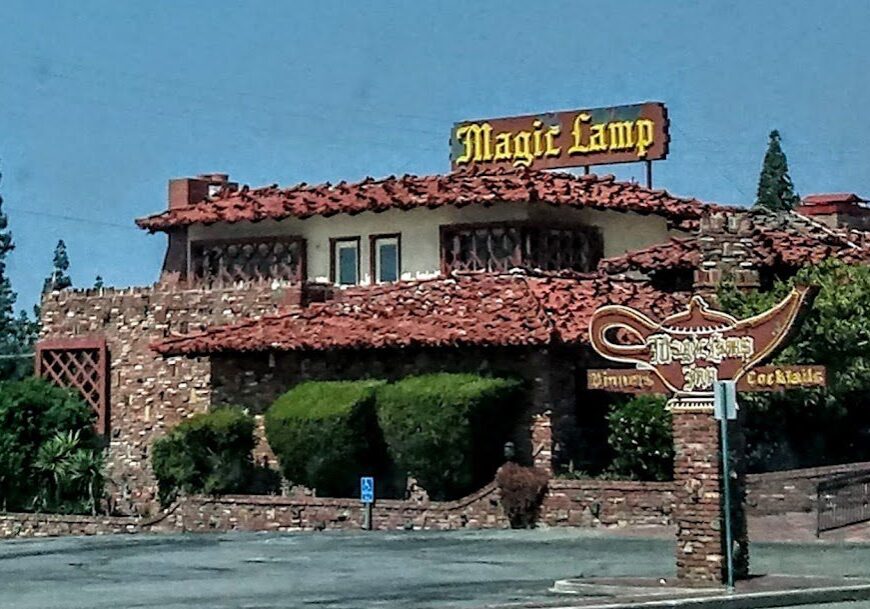 Stone restaurant building with "Magic Lamp" sign.