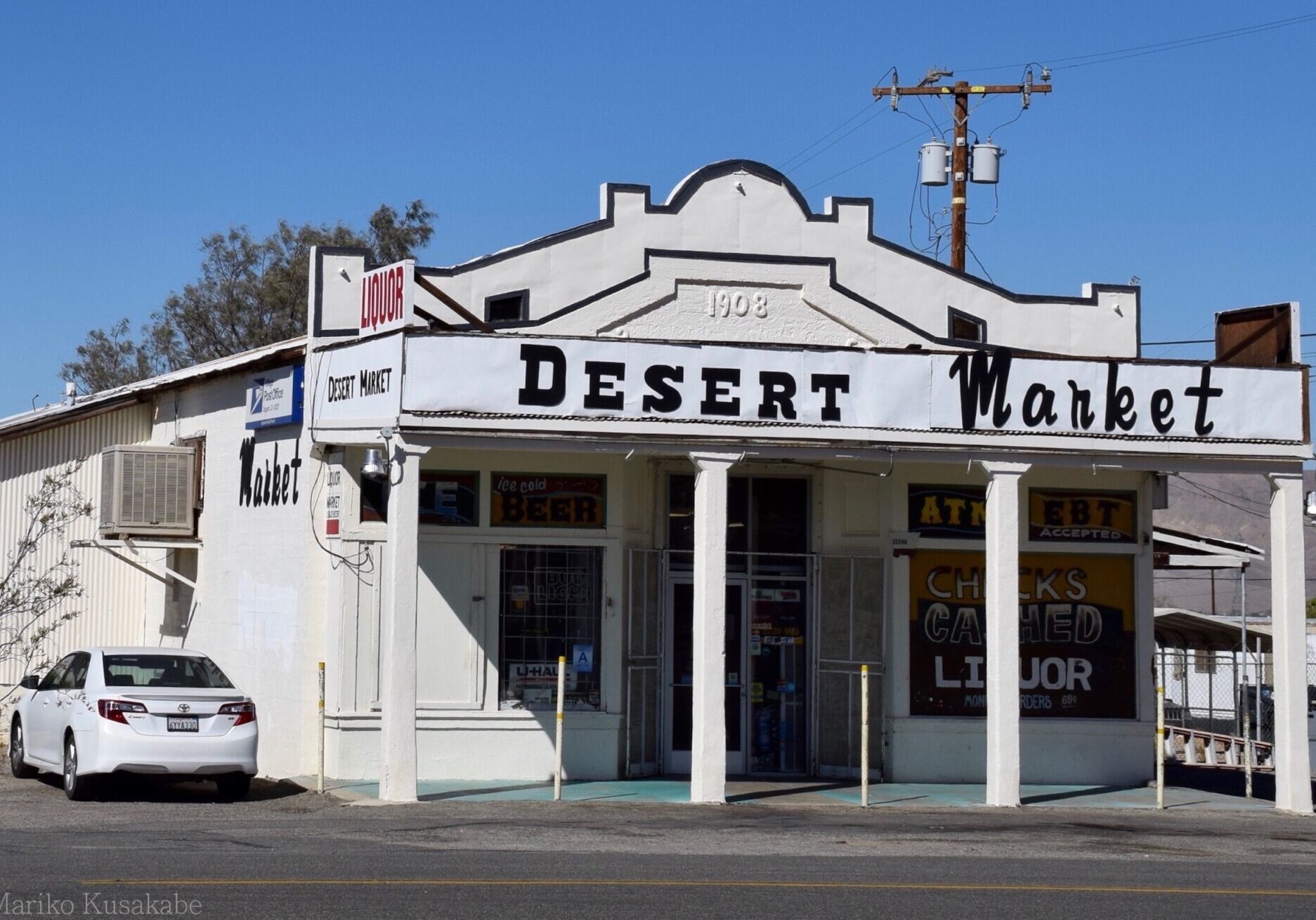 Vintage Desert Mart store with classic signage under a clear sky.