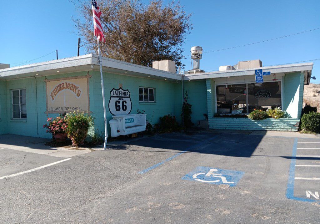 Retro-themed Route 66 cafe with vintage decor and handicapped parking.