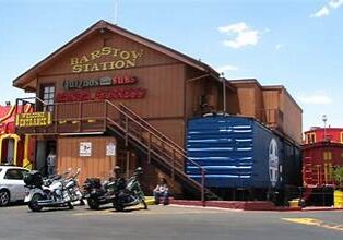 Exterior of HapiToy Station with motorcycles parked outside.